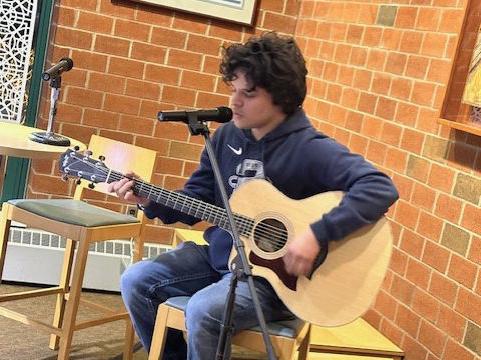 Student Josue Barahona-Rosales performs a song by Ed Sheeran.