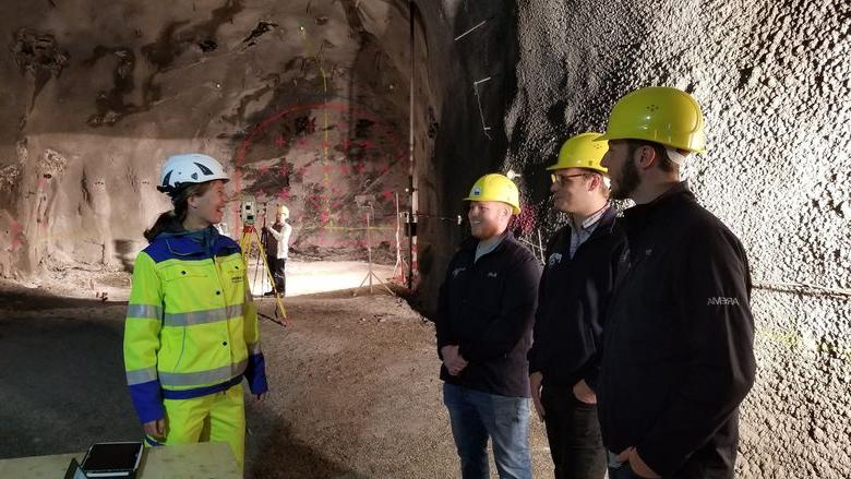 Students and Joe Scott speak with engineer before working on 360-degree video in Europe